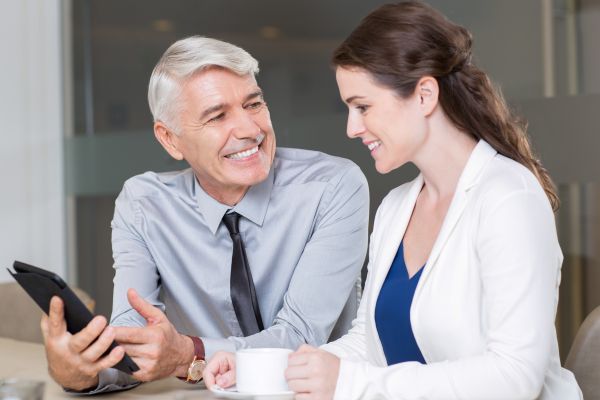 happy business people discussing project cafe (1)